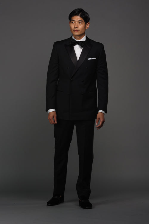 Men's double breasted black tuxedo suit made of wool and lycra blend. Shop stylish high-quality mens tuxedo suit by Ike Behar.