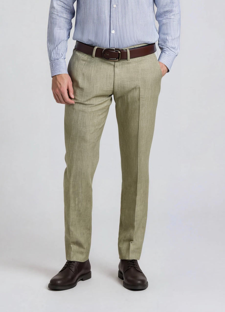 Man wearing a light blue striped shirt, beige pants, and brown shoes on a white background