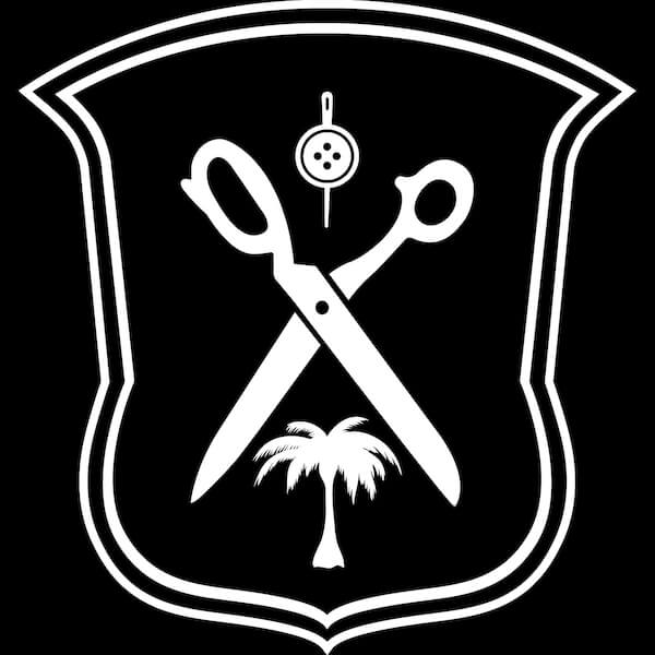 Ike Behar crest showing button, tailor scissors and a palm tree