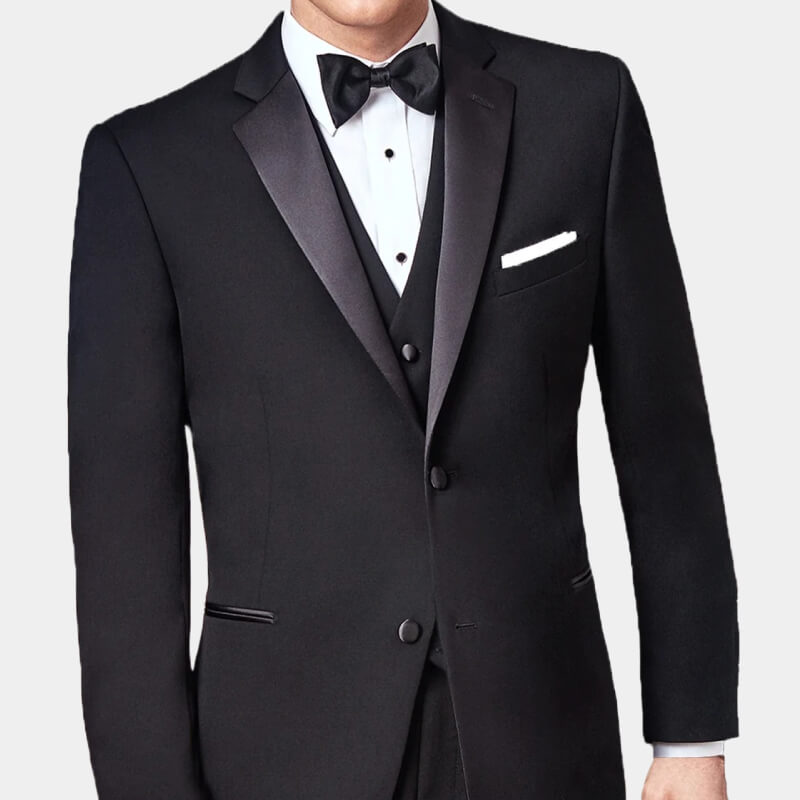 Ike Behar tuxedo and bow-tie against pale gray background