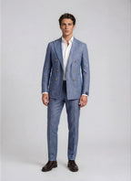 Man wearing a blue suit with tan buttons on a white background